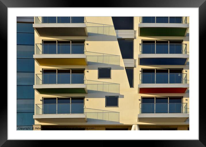 Apartments at Westcliff on Sea form abstract patterns in the sunlight . Framed Mounted Print by Peter Bolton
