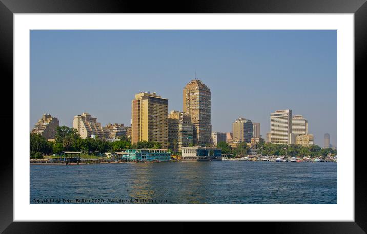 A part of the city skyline from the River Nile, Cairo, Egypt. Framed Mounted Print by Peter Bolton