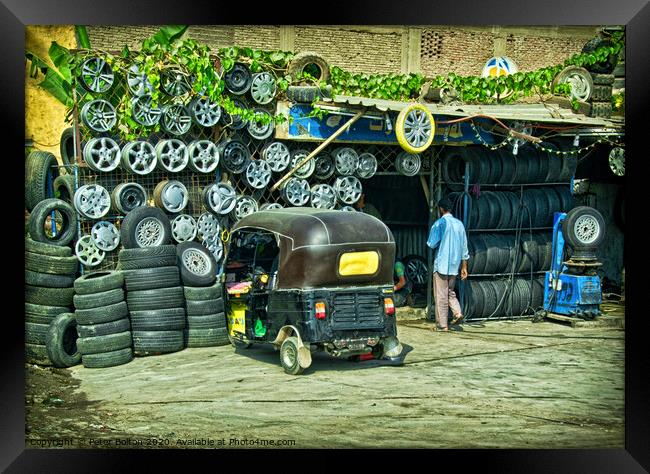 Tyre fitter business on the outskirts of Cairo, Egypt. Framed Print by Peter Bolton