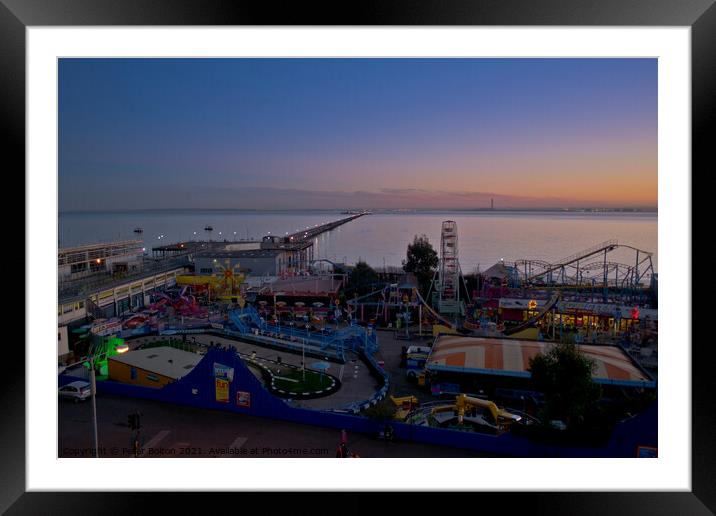 Evening view of the seafront at Southend on Sea showing 'Adventure Island' and the pier. Framed Mounted Print by Peter Bolton