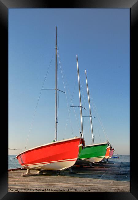 Sailing dinghies on a wooden jetty at Westcliff on Sea, Essex, UK. Framed Print by Peter Bolton