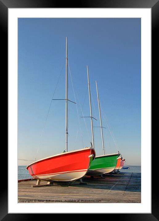 Sailing dinghies on a wooden jetty at Westcliff on Sea, Essex, UK. Framed Mounted Print by Peter Bolton