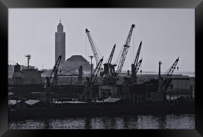Docks at Casablanca harbour with the Grand Mosque in the background. Framed Print by Peter Bolton
