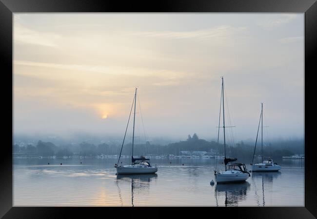 Yachts on Windermere - Misty Sunrise Framed Print by Chester Tugwell