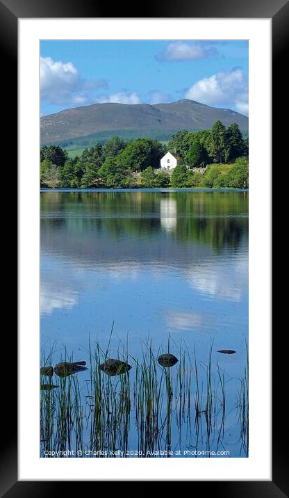 View Across Loch Alvie to the Church Framed Mounted Print by Charles Kelly