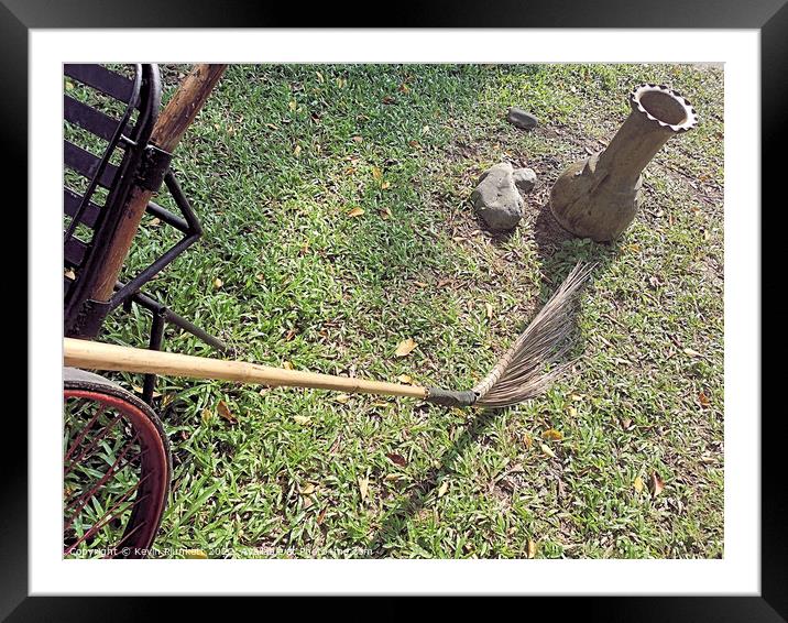 Photo of cartwheel, Broom and vase on grass  Framed Mounted Print by Kevin Plunkett