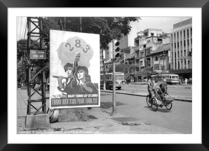 A city street in Saigon, Ho Chi Minh City Vietnam. 1991 Framed Mounted Print by Kevin Plunkett