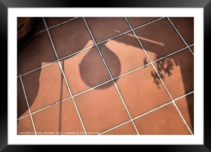 Shadows on floor tiles Framed Mounted Print by Kevin Plunkett