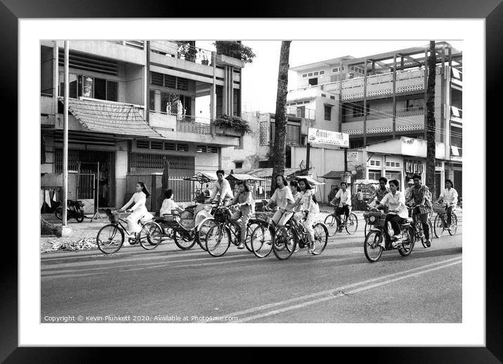Saigon pedal power, Vietnam Framed Mounted Print by Kevin Plunkett