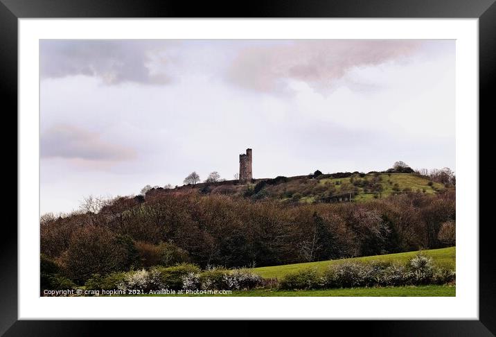 A castle on top of a grass covered field Framed Mounted Print by craig hopkins