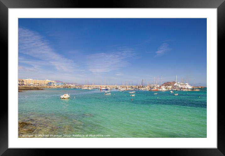 Small boats moored in the bay, next to the harbour Framed Mounted Print by Michael Shannon