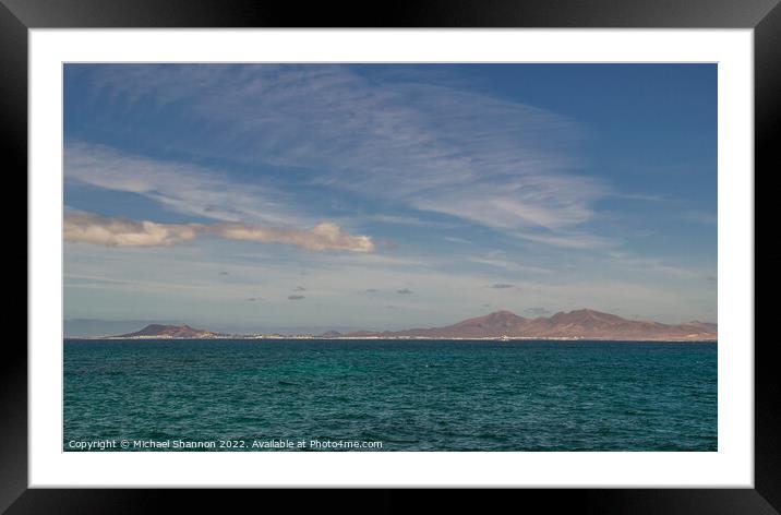 Looking across the sea from Fuerteventura to Playa Framed Mounted Print by Michael Shannon