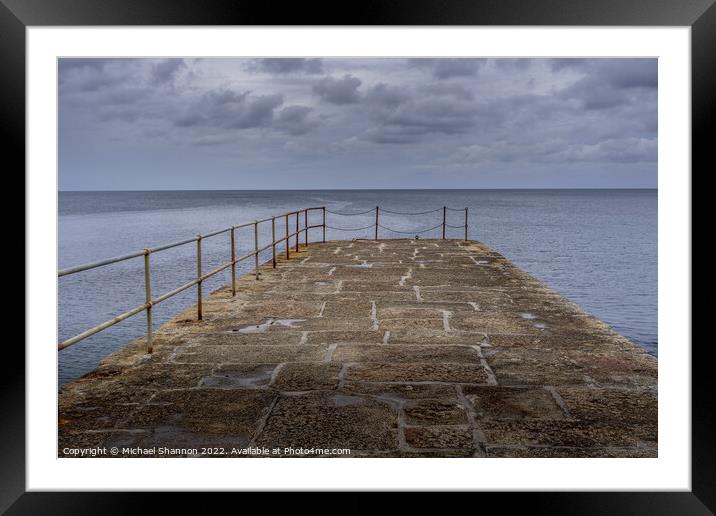 Looking out to sea from the stone pier at Porthlev Framed Mounted Print by Michael Shannon