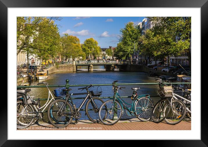 Bridge, canal view and bikes - Amsterdam Framed Mounted Print by Michael Shannon