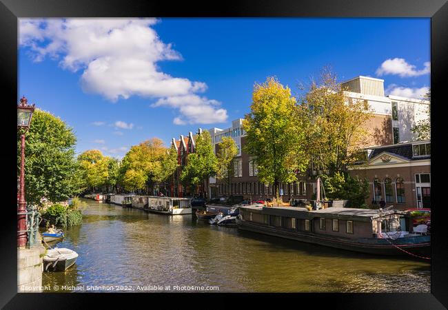 Canal and house boats - Amsterdam Framed Print by Michael Shannon