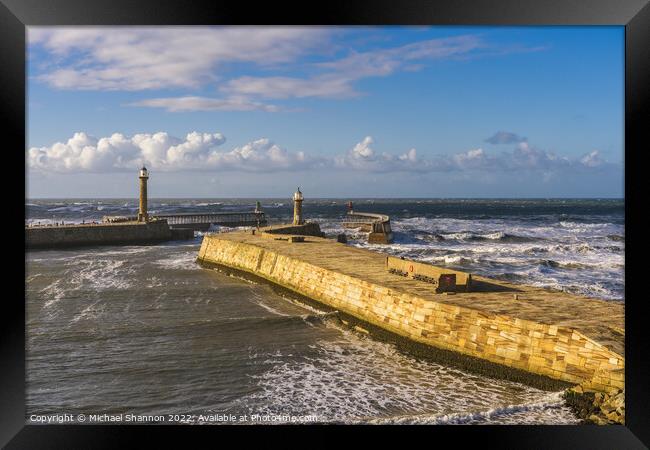 Clifftop view of the East Pier in Whitby, North Yo Framed Print by Michael Shannon