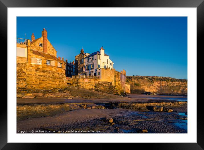 Robin Hoods Bay shot from the beach at low tide. Framed Mounted Print by Michael Shannon