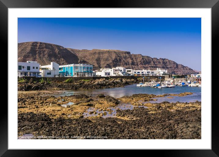 Seafront buildings in the seaside village of Orzol Framed Mounted Print by Michael Shannon