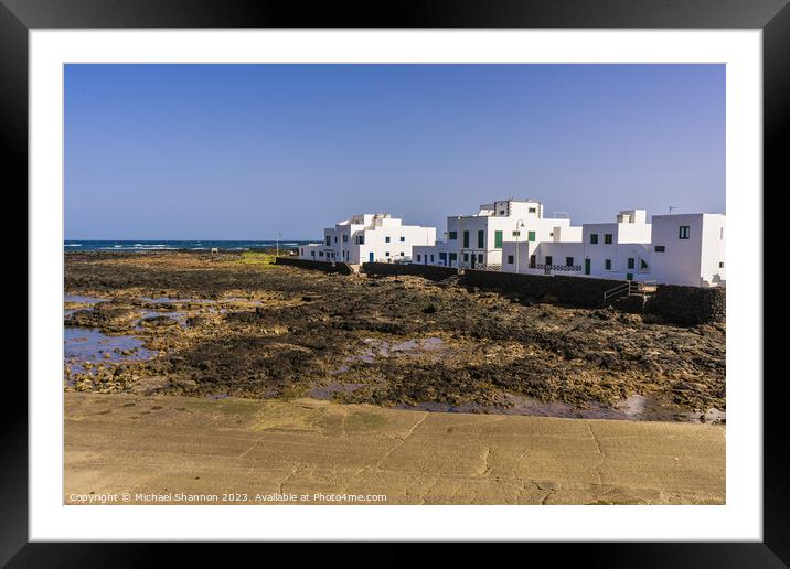 Beachfront houses, Orzola, Northern Lanzarote. Framed Mounted Print by Michael Shannon