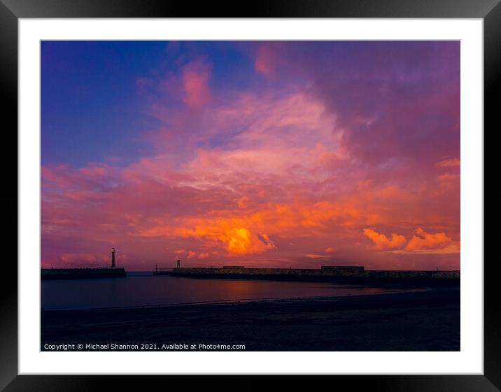 Colourful sky over the piers at Whitby in North Yo Framed Mounted Print by Michael Shannon