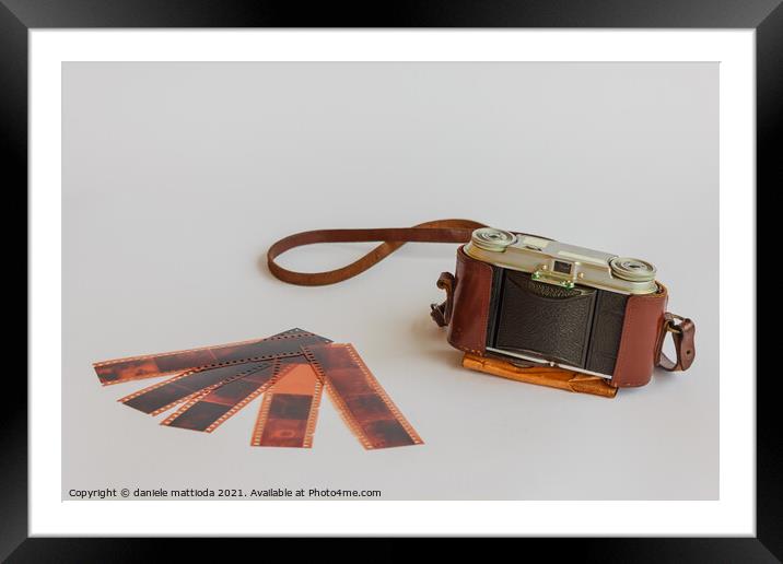 old camera with negative Framed Mounted Print by daniele mattioda