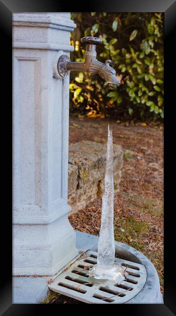 the jet of a fountain frozen by the cold Framed Print by daniele mattioda