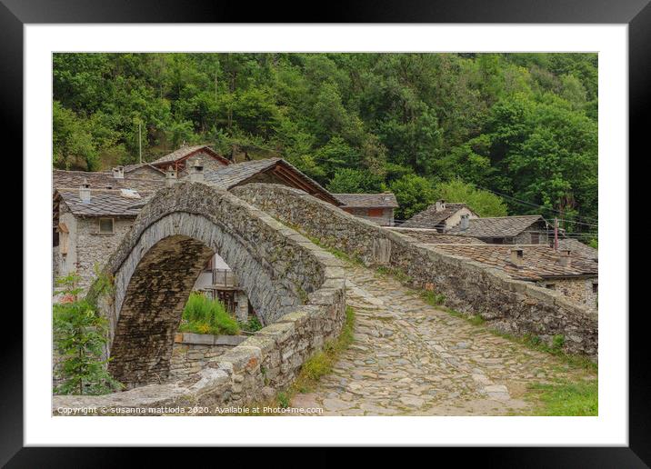  a  vintage  bridge  of an Italian alpine village Framed Mounted Print by susanna mattioda