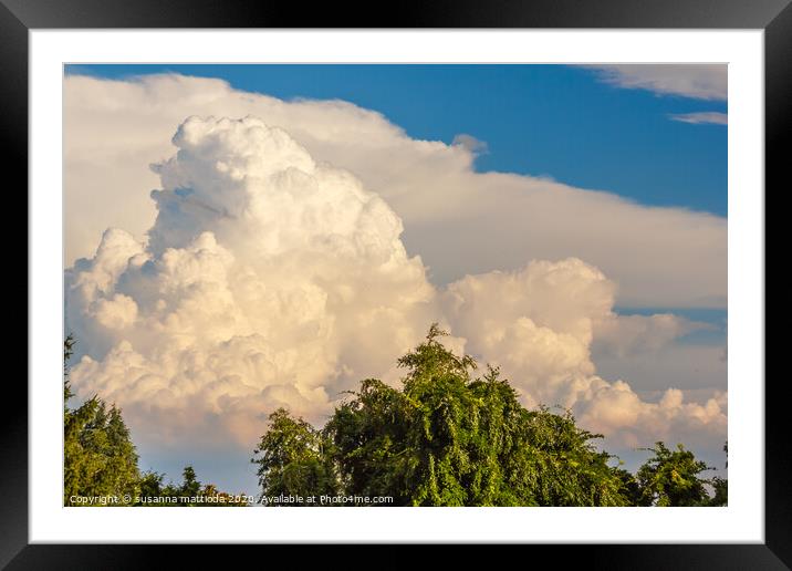 a landscape of trees of white clouds and real green trees Framed Mounted Print by susanna mattioda