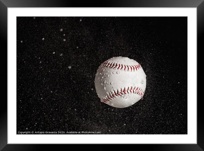Baseball ball flying in the rain. Framed Mounted Print by Antonio Gravante