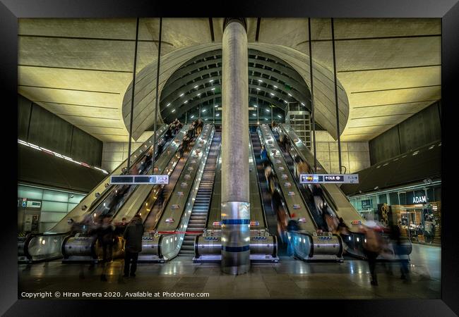 Escalators at Canary Wharf Station Framed Print by Hiran Perera