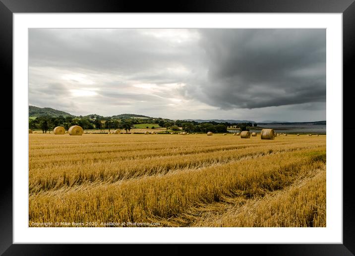 "Dramatic Autumn Harvest: Stormy Barley Straw Bale Framed Mounted Print by Mike Byers