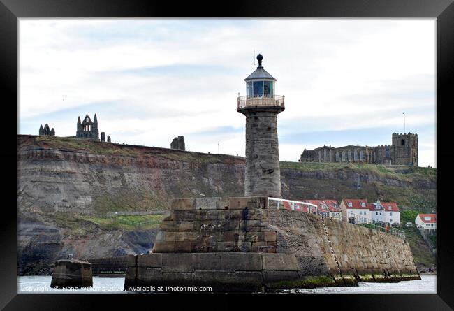 Whitby Abbey St Mary's Church and the lighthouse f Framed Print by Fiona Williams
