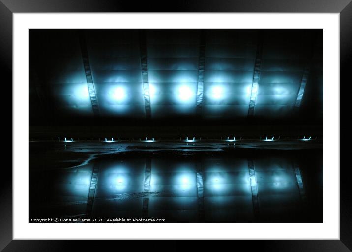 Glasgow Imax lights reflected in the water below Framed Mounted Print by Fiona Williams