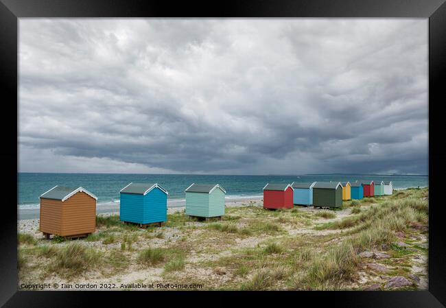 Beach Huts  and Coastal Sea View Findhorn Moray Scotland Framed Print by Iain Gordon