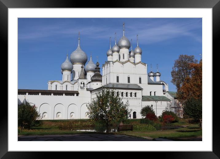 Historical landscape. A beautiful white Christian Church against a blue sky Framed Mounted Print by Karina Osipova