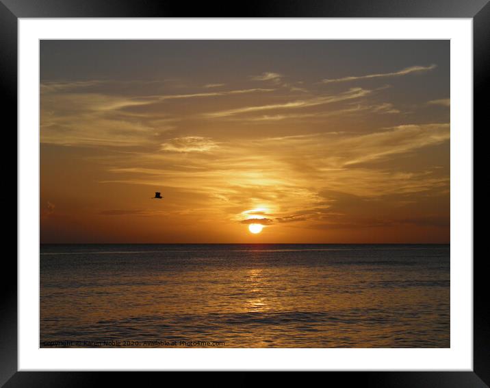 Sunset at sea in Bayahibe in Dominican Republic be Framed Mounted Print by Karen Noble