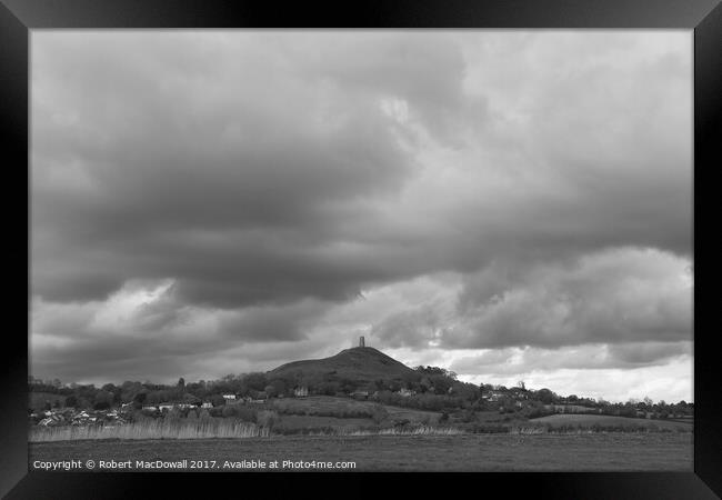 Storm clouds gather over Glastonbury Tor Framed Print by Robert MacDowall