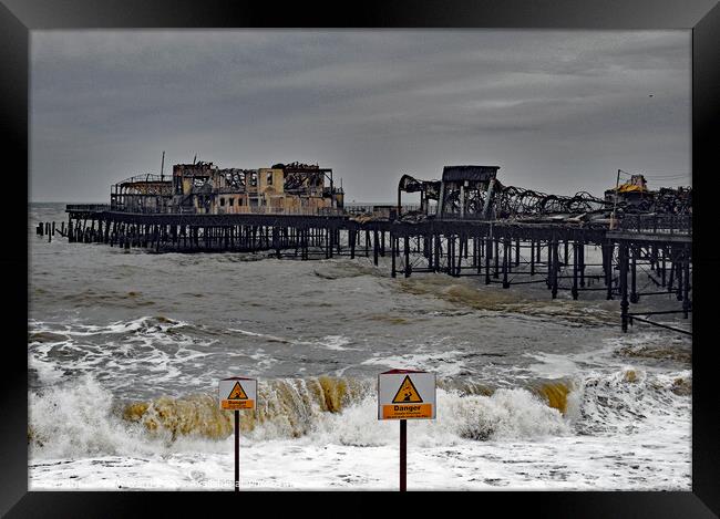 Fire Damage to Hastings Pier 2010. Framed Print by Mark Ward