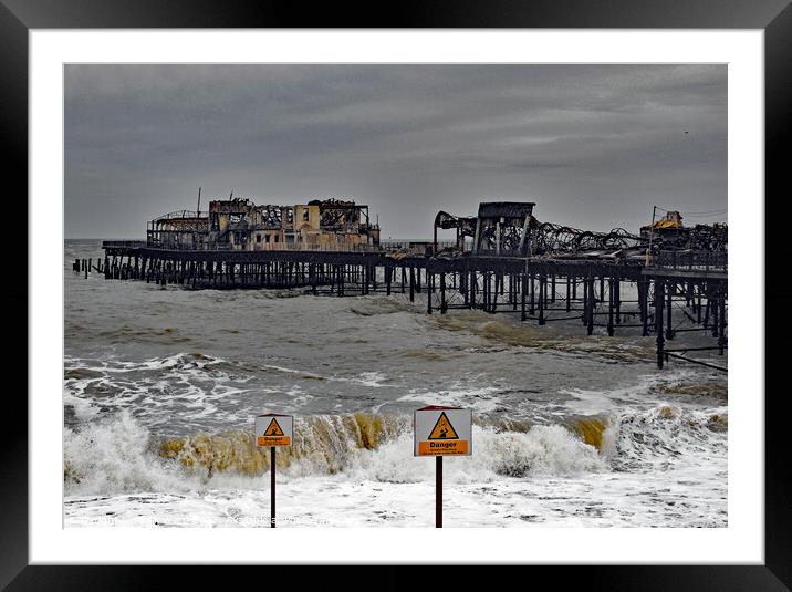 Fire Damage to Hastings Pier 2010. Framed Mounted Print by Mark Ward