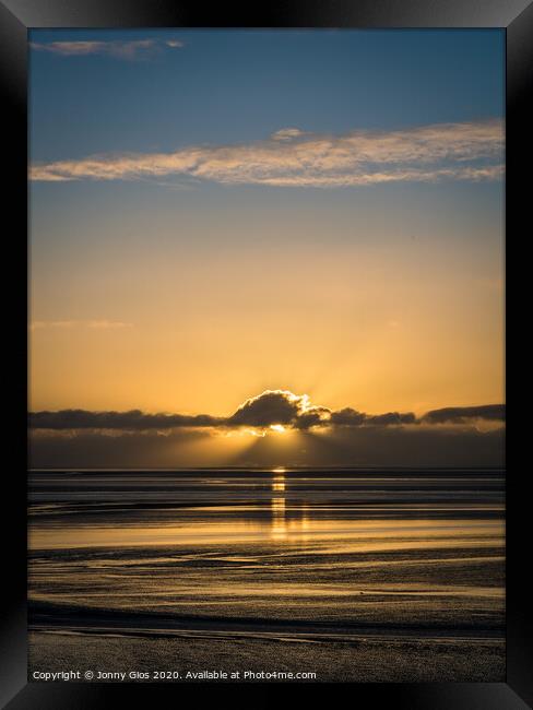 Sunset behind the clouds  Framed Print by Jonny Gios