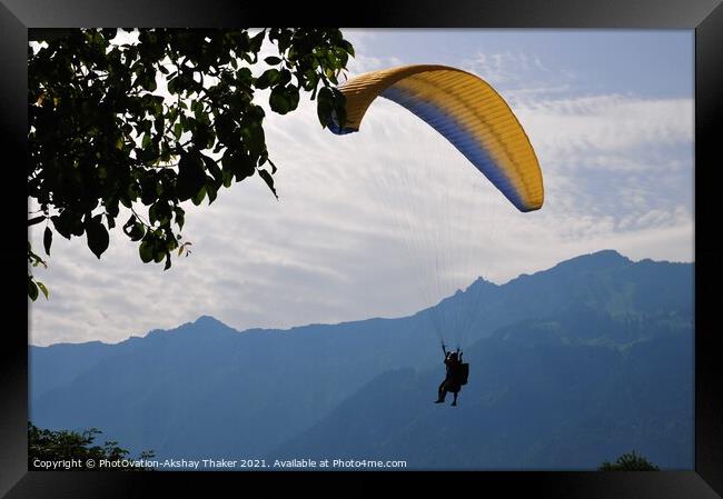 A person flying through the air on top of a mounta Framed Print by PhotOvation-Akshay Thaker