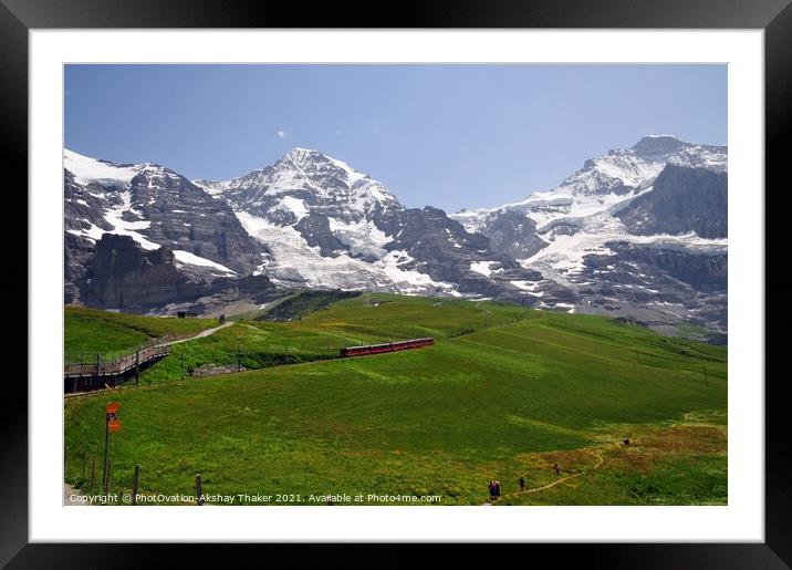Famous electric red tourist train with mountains in the background Framed Mounted Print by PhotOvation-Akshay Thaker