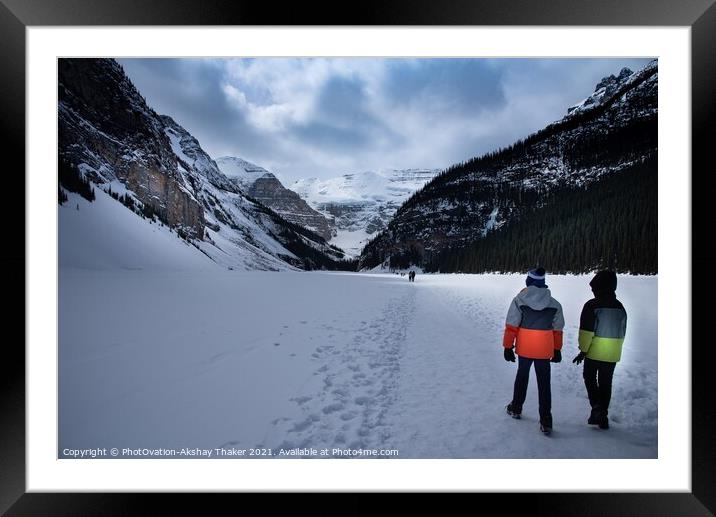 Tourists kids are walking on top of the frozen lake Louise Canadian and Tourists are enjoying winter Framed Mounted Print by PhotOvation-Akshay Thaker