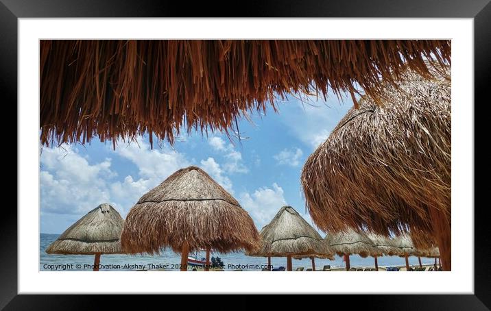 View of ocean through Sunshades at sandy beach in Mexico Framed Mounted Print by PhotOvation-Akshay Thaker