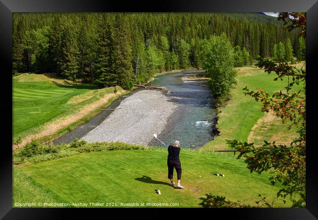 A woman is driving a golf ball on a beautiful golf course.  Framed Print by PhotOvation-Akshay Thaker