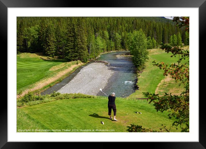 A woman is driving a golf ball on a beautiful golf course.  Framed Mounted Print by PhotOvation-Akshay Thaker