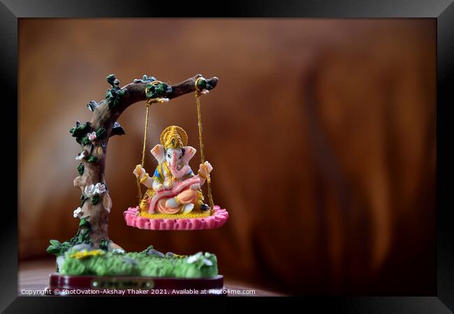 Hindu God-Ganesha in art form sitting on a swing.  Framed Print by PhotOvation-Akshay Thaker