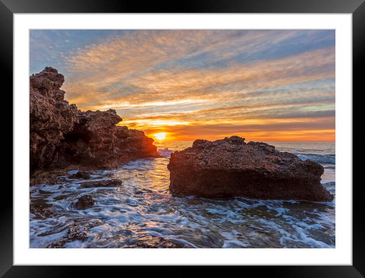 Photography with a sunrise between the rocks in a seascape Framed Mounted Print by Vicen Photo