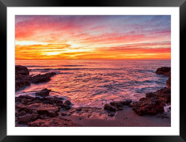 Photograph with a reddish sunrise in a small cove of la renega in Oropesa Framed Mounted Print by Vicen Photo