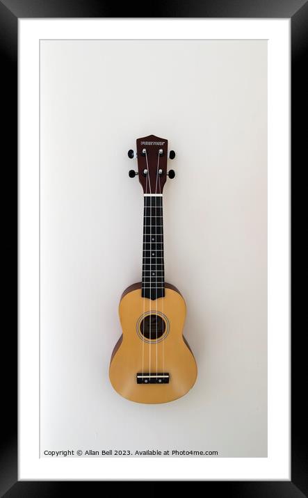  Ukulele hanging on wall Framed Mounted Print by Allan Bell